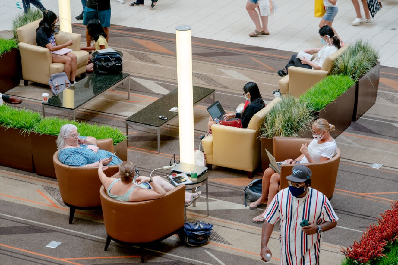 Visitors sit in the hall while charging their devices at Westfarms.